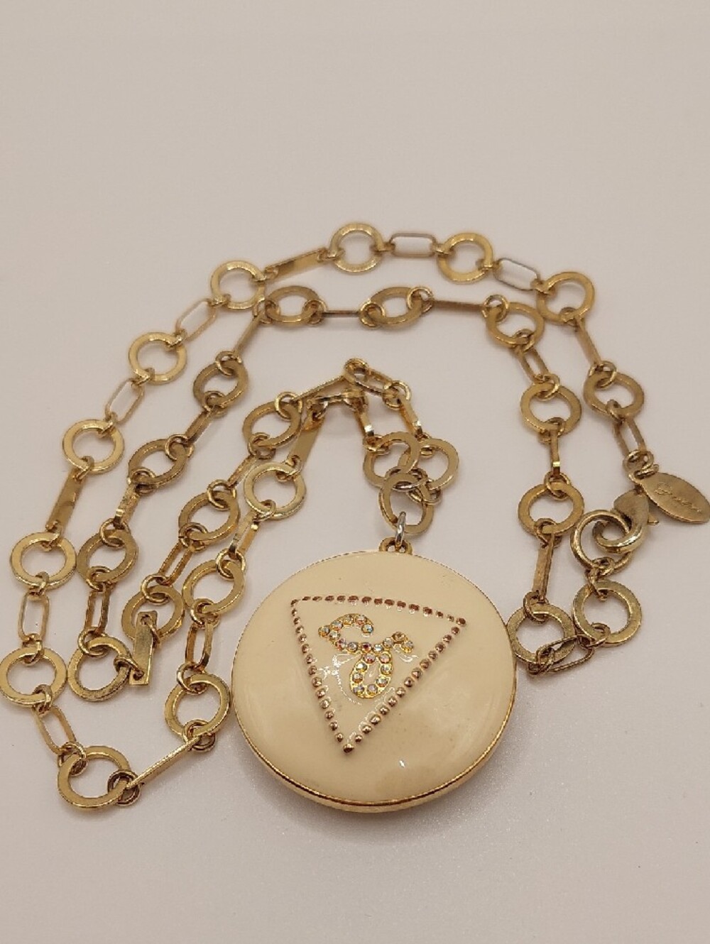 GUESS Blingy AB Gold-Tone Long Pendant Necklace with Cream Enamel Locket - Picture 7 of 14